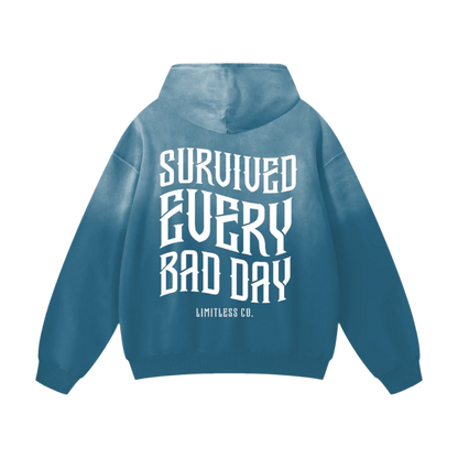 SURVIVED EVERY BAD DAY - HEAVYWEIGHT SUNFADE OVERSIZED HOODIE